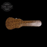 Rust-colored guitar neck on a black background with 'Tone Shop' logo.