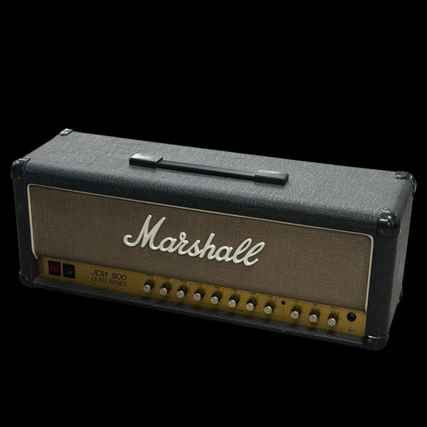 Marshall guitar amplifier head on a black background with 'Tone Shop' logo.