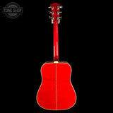 A bright red acoustic guitar shown from the back against a solid black background, with a Tone Shop watermark in the top-left corner.