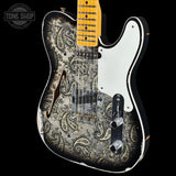 A Fender Telecaster-style electric guitar with a distressed black and silver paisley pattern on the body, a white pickguard, and a yellow maple neck, shown against a black background with a Tone Shop watermark in the top left.