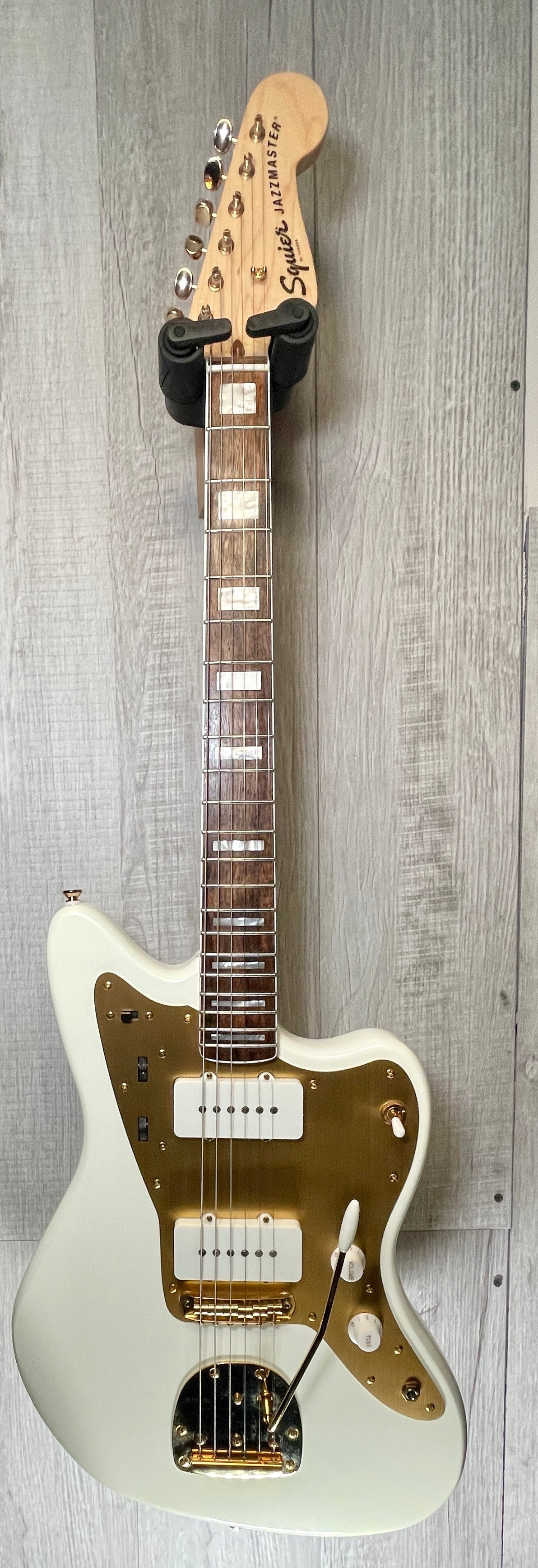 Front full view of Used 2022 Squire 40th Anniversary Jazzmaster Gold Edition Olympic White