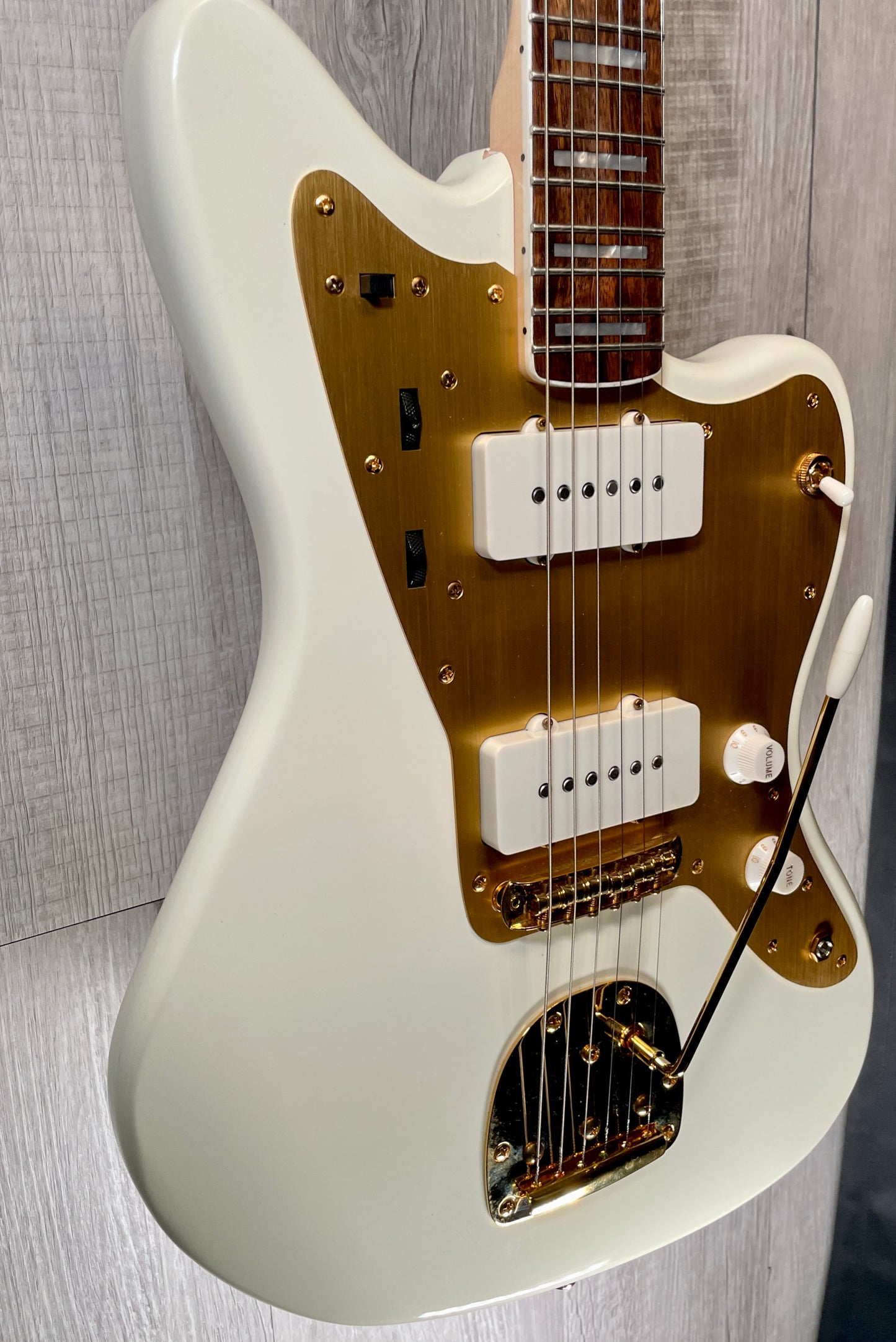 Side view of Used 2022 Squire 40th Anniversary Jazzmaster Gold Edition Olympic White