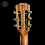 Close-up of the headstock of an acoustic guitar, showing the brand name 'Alhambra' and six tuning pegs against a solid black background.
