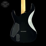 The back of an electric guitar body, featuring a glossy black finish, a white side contour, and a light wood neck visible at the top, set against a solid black background.