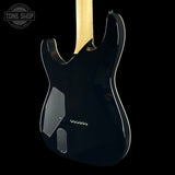 Rear view of an electric guitar body in glossy black, showing the pickguard, control plate, and part of the light wood neck against a black background.