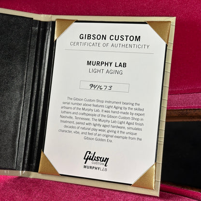 Gibson Custom Certificate of Authenticity for a guitar on a pink background
