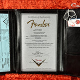 Fender certificate of authenticity for a Custom 60 Strat Rel guitar on an orange background