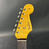 Fender guitar headstock on a dark background