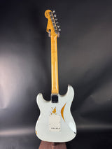 White electric guitar on a dark background
