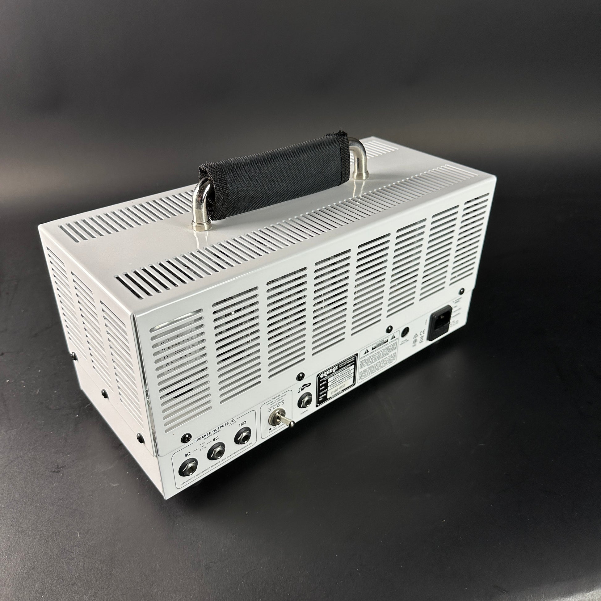 White electronic device with a handle on a black background