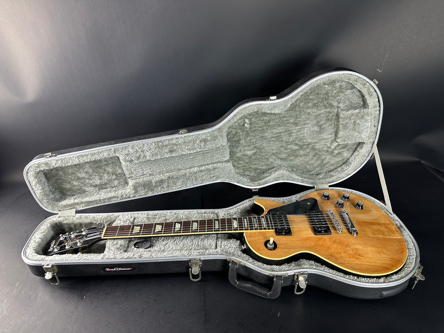 Electric guitar in a hard case on a dark background