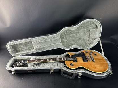 Electric guitar in a hard case on a dark background