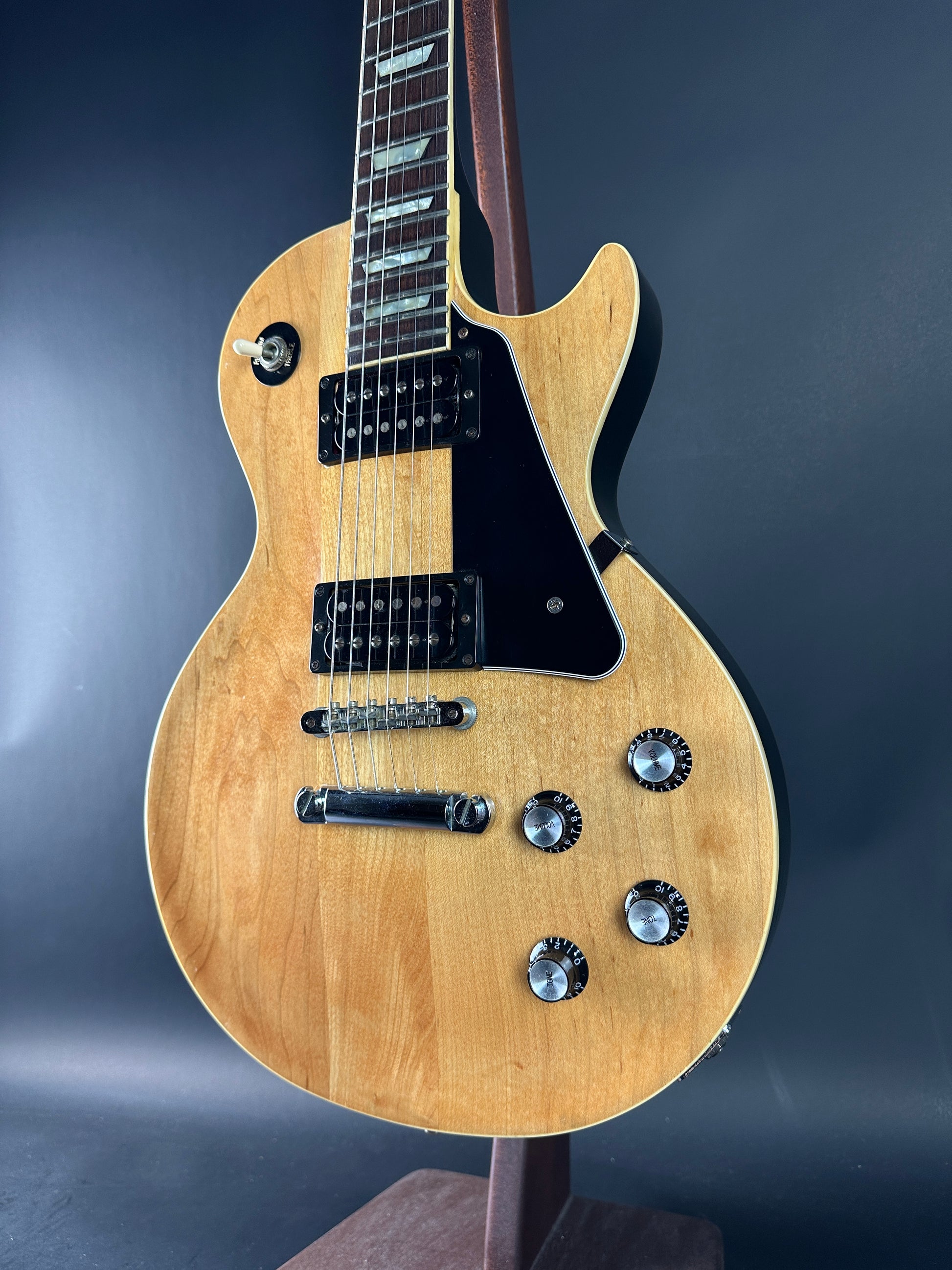 Close-up of a guitar on a dark background