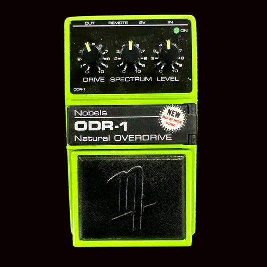 Front of Nobels ODR-1 Overdrive effects pedal on black background