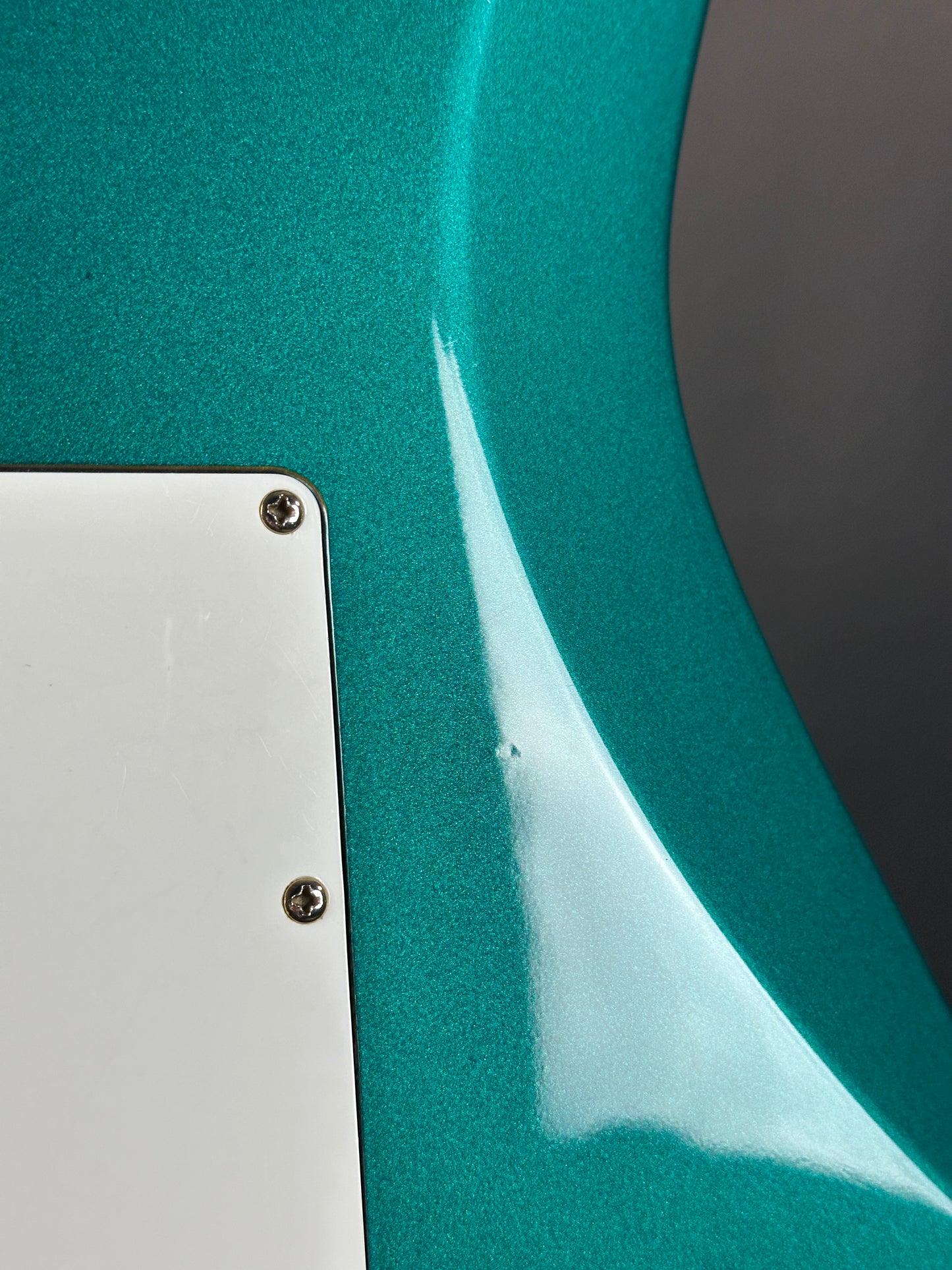 Wear on back of Used Ibanez EX1500 Teal.