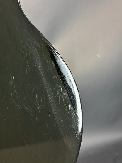 Close-up of a spoon with visible scratches on its surface