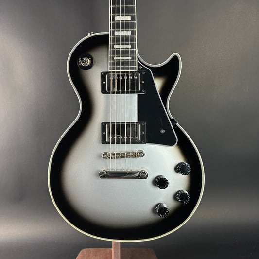 Electric guitar with a black and white design on a gray background
