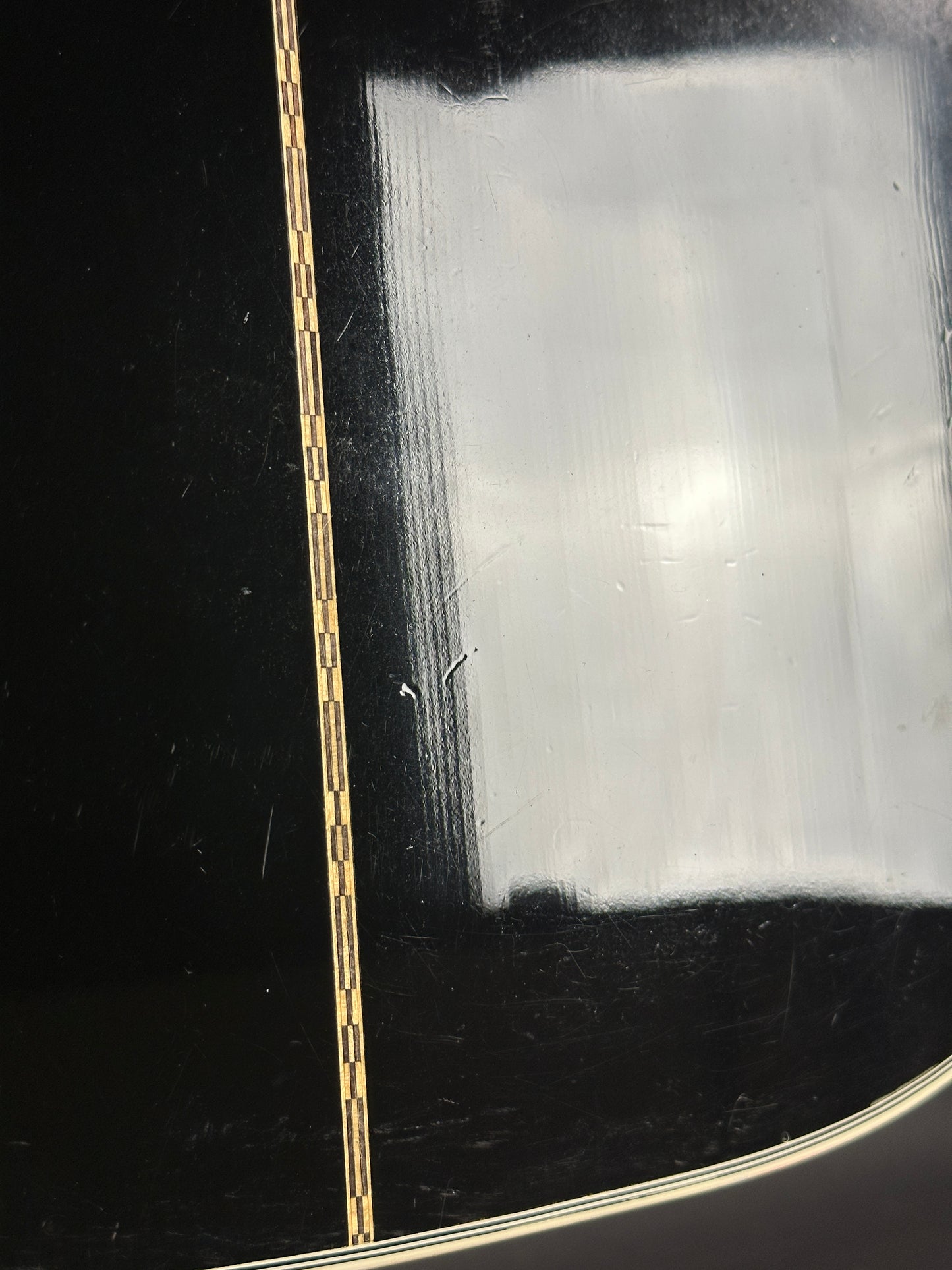 Close-up of a guitar string on a black background