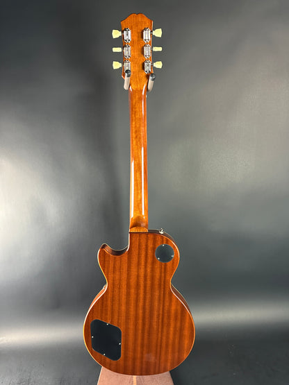 Wooden electric guitar on a gray background