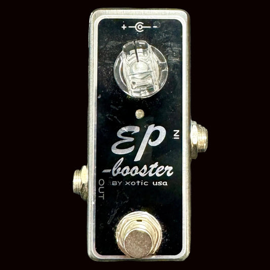 Xotic USA EP Booster guitar effects pedal on a textured surface