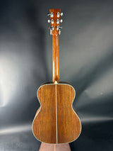 Acoustic guitar body on a gray background