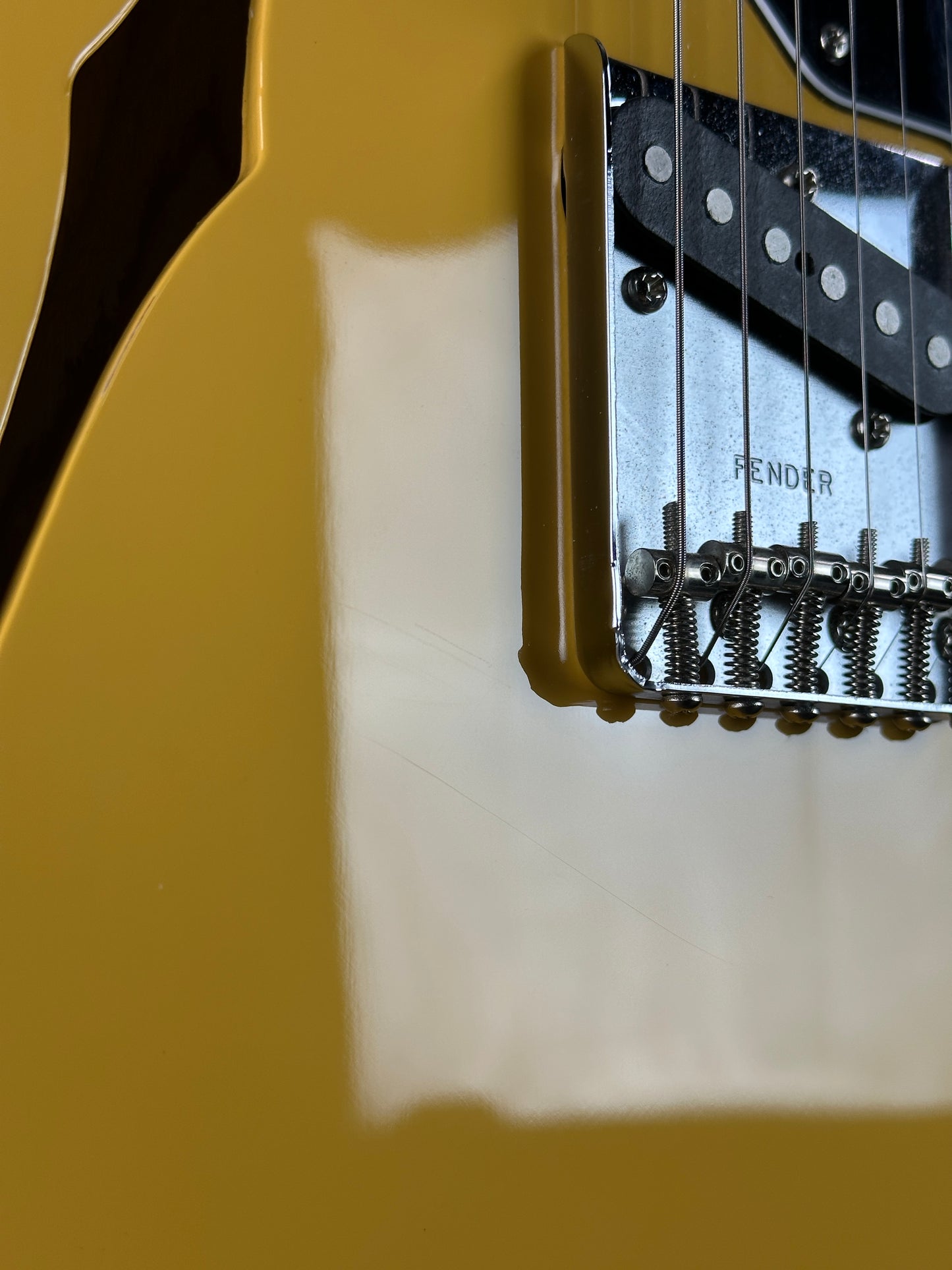 Close-up of a guitar's bridge