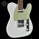 A white Telecaster-style electric guitar with a pale green pickguard, shown against a black background. The neck is visible at the top, and a Tone Shop watermark is in the upper left corner.