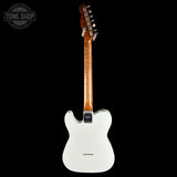 A white electric guitar shown from the back against a solid black background, with a Tone Shop watermark in the upper left corner.
