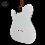 White electric guitar body with a black pickguard and a brown wood neck, shown against a black background with a Tone Shop watermark in the top left.