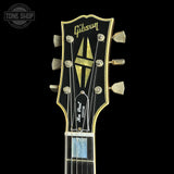 Headstock of Gibson Custom Limited 68 Les Paul Custom Ebony Top Gold Back Light Aged.