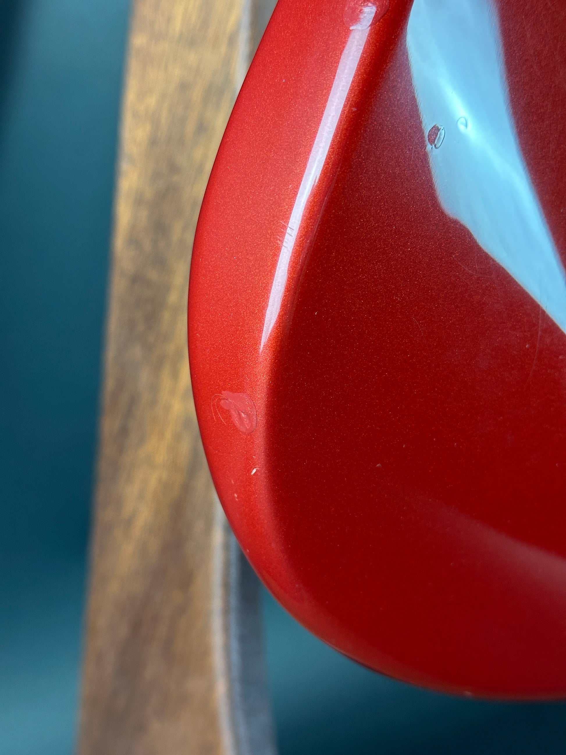 Ding on side of Used Fender MIM Stratocaster Red.