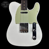 A white Telecaster-style electric guitar with a pale green pickguard, black control plate, and dark fretboard, shown against a black background. A Tone Shop watermark is visible in the top-left corner.