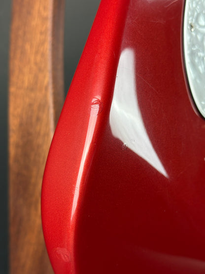Wear on side edge of Used Fender MIM Stratocaster Red.