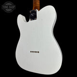 A white electric guitar body, likely a Fender Telecaster style, shown from the back against a solid black background. The neck is visible at the top with a brown wood finish, and a 'TONE SHOP' watermark is in the upper left corner.