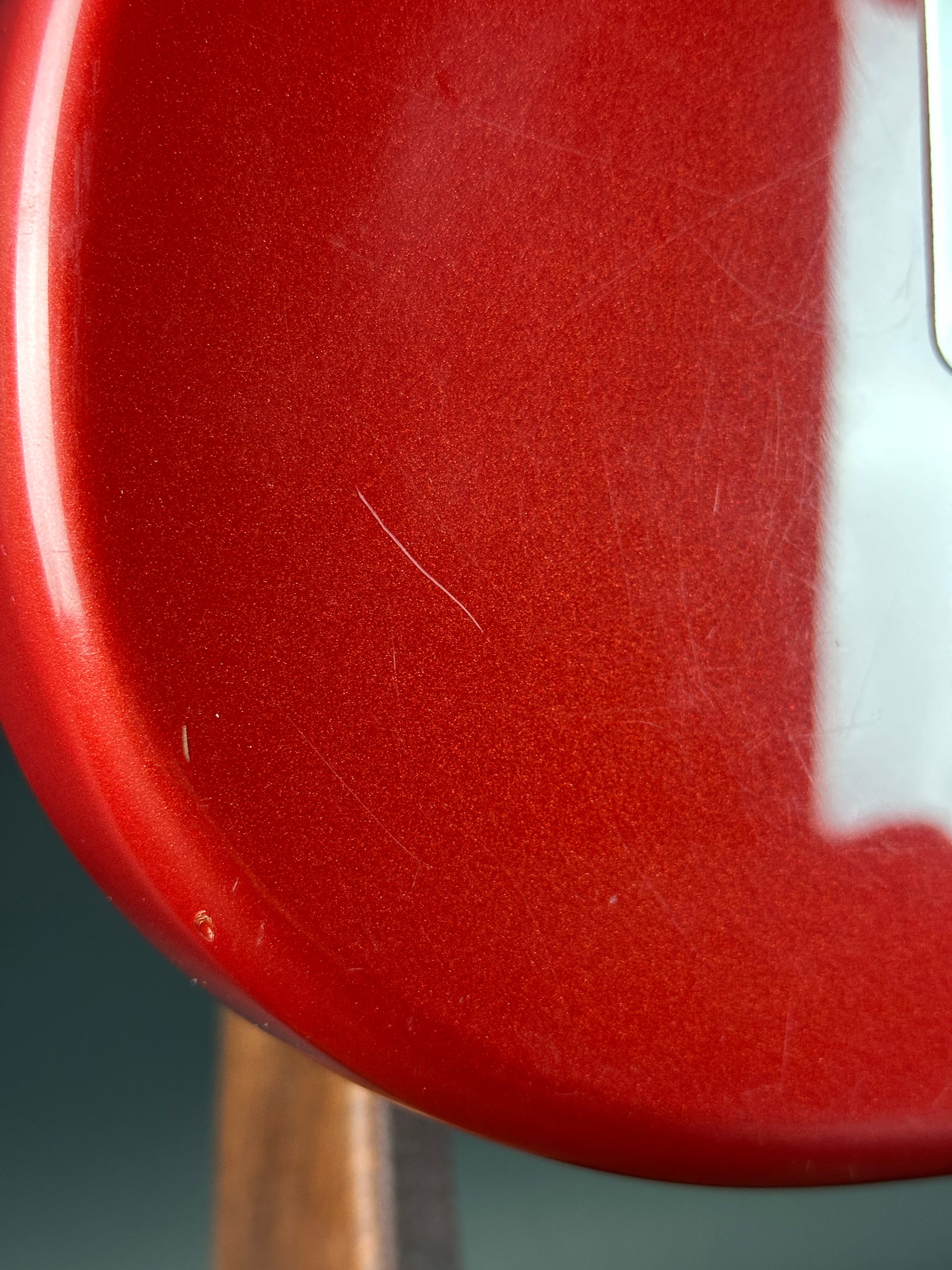 Close-up of a red surface with a scratch