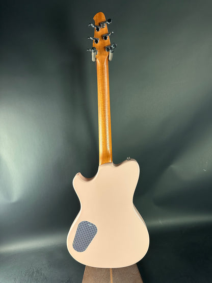 Back view of a guitar with a dark gray background