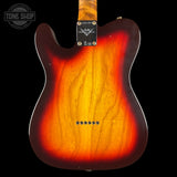 The back of a Fender Telecaster electric guitar with a classic sunburst finish, showing a bright yellow-orange center fading to dark brown and black edges. The Fender logo is visible on the headstock plate, and a Tone Shop watermark is in the top-left corner.