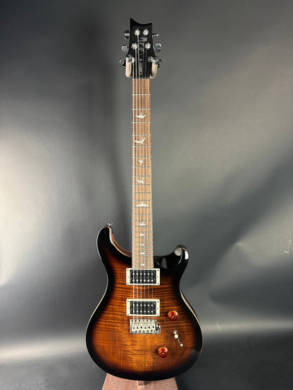 Electric guitar with a sunburst finish on a gray background