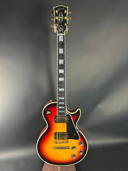 Electric guitar with a sunburst finish on a gray background