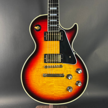 Electric guitar with a sunburst finish on a dark background