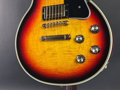 Close-up of a sunburst electric guitar on a dark background