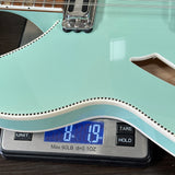 Used 2025 Rickenbacker 360/12 Seafoam Green Pearl 12 String on scale displaying weight.