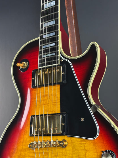 Electric guitar with a sunburst finish on a dark background