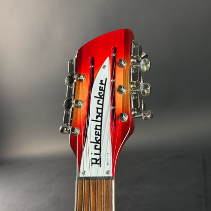 Guitar headstock with Rickenbacker logo on a gray background