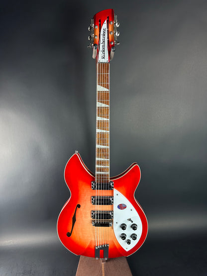 Red electric guitar on a dark gray background