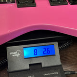 Jackson Custom Shop USA Special Edition Soloist Platinum Pink on scale displaying weight.