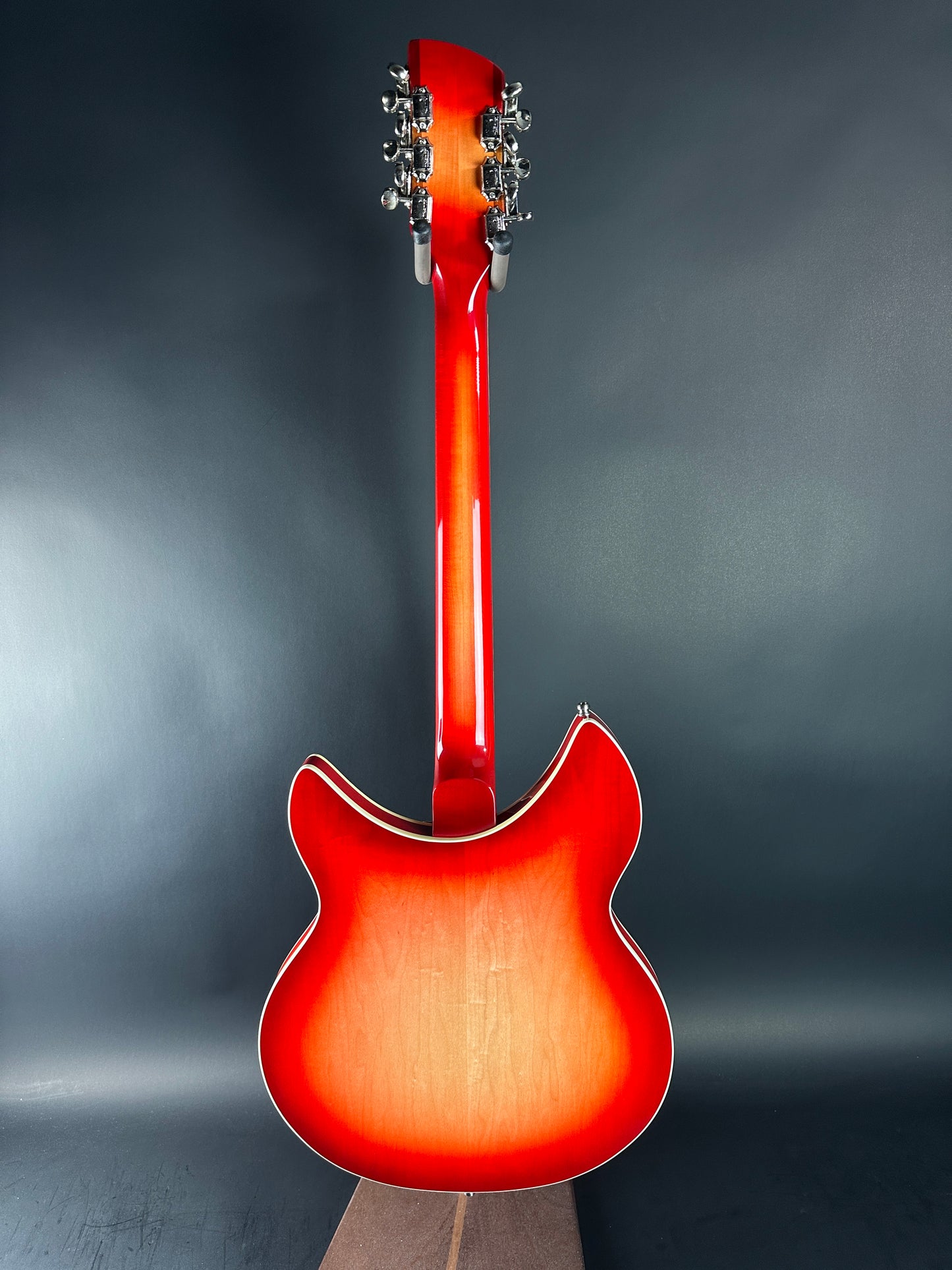 Red electric guitar on a dark gray background