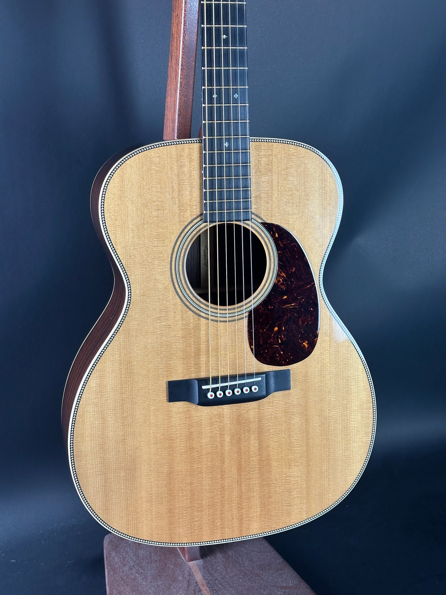 Acoustic guitar on a dark blue background