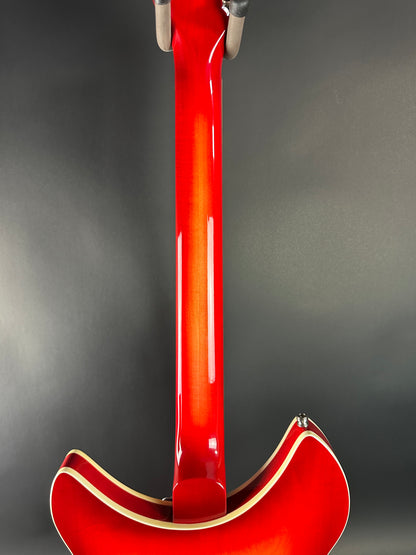 Red electric guitar on a gray background