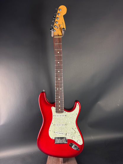 Red electric guitar on a gray background